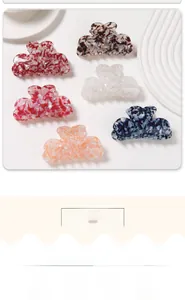 Collection of French heart-shaped hair claws in marble and tortoiseshell patterns