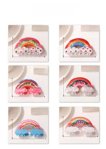 Detail view of 6 colorful rainbow cloud hair claws with dimensions 5cm in height