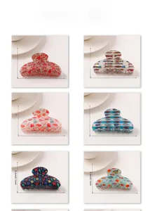 Selection of large ocean-themed hair claws featuring starfish and seashell patterns