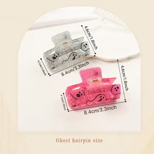 Ghost hair claw clip set for Halloween featuring spider web patterns and glitter resin