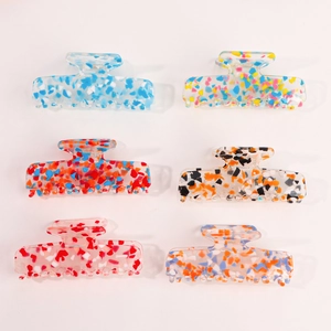 Set of 6 colorful acrylic hair claws with marble texture in various vibrant patterns