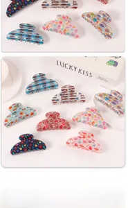 Detail showing various ocean themed hair claws with sea shells and starfish patterns
