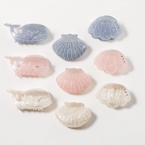 Ocean series whale and shell hair claws in lilac and pearl colors with glitter finish