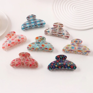 Set of 7 ocean-themed hair claw clips featuring starfish, seashell and tropical fish designs