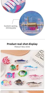 Detailed close-up of strong custom metal spring mechanism on colorful fish hair claw clips
