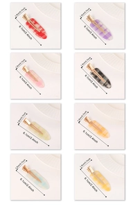 Detailed view of checkered hair clips in eight colors with precise size measurements