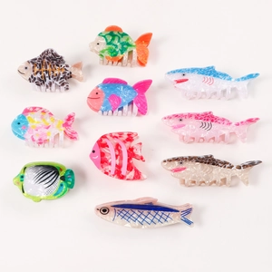 Set of 10 colorful sea animal hair claws featuring sharks and tropical fish shapes