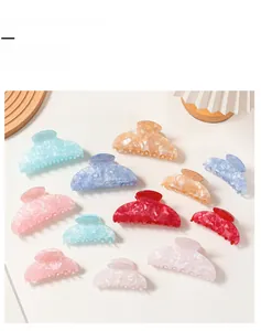 Detailed comparison of colorful marble hair claw clips in various sizes and macarons colors