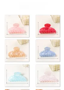 Collection of large marble texture hair claw clips in six vibrant colors for women