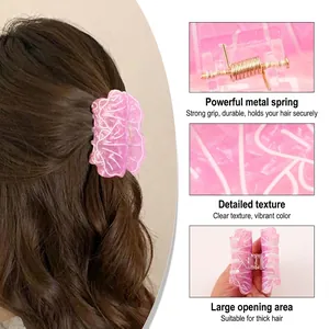 Pince à cheveux en acétate rose marbré pour cheveux épais avec ressort doré robuste