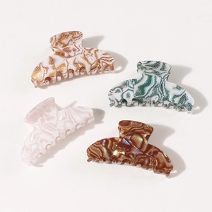 Lot de quatre pinces à cheveux géométriques en finitions marbre, vert, rose et ambre