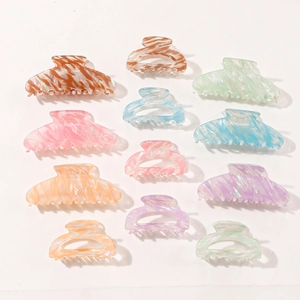 Colorful marble pattern acrylic hair claws in assorted pastel colors and sizes