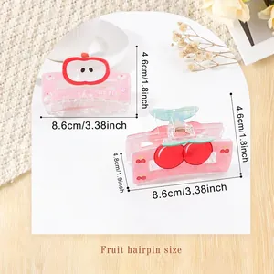Cute fruit-shaped acrylic hair claws featuring cherry and apple designs in pink resin