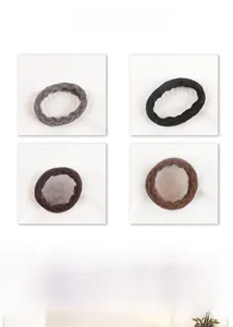 Detail view of plush high-elastic hair ties in gray, black, dark coffee and light brown