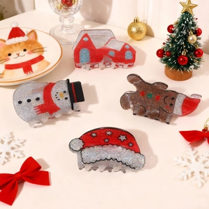 Glitter Christmas hair claw set with gingerbread man, snowman, and Santa hat designs