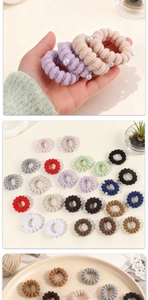 Macro detail of high-elastic pearl hair ties in various colors for high ponytails