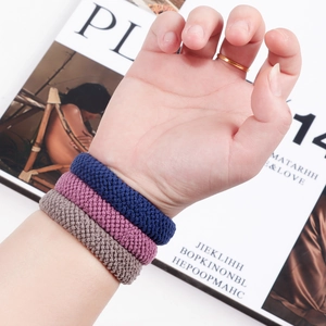 Three-piece thick high-elasticity hair ties in navy blue, burgundy and brown on wrist