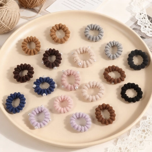 Set of 18 elastic pearl ponytail holders in Morandi tones with spiral knit texture