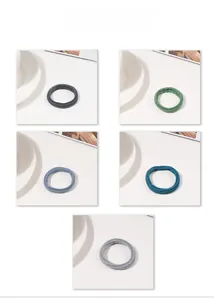 Close-up of seamless high-elastic hair ties in five colors showing knit texture