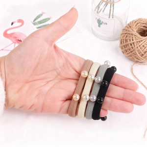 Elastic fabric hair ties with pearl accents in Morandi coffee, beige, grey, and black tones