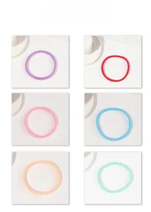 Close-up of macaron colored seamless hair ties in purple red pink blue orange green