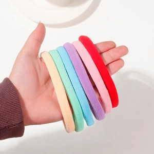 Set of 6 colorful high-elastic macaron seamless flocked hair ties held in hand
