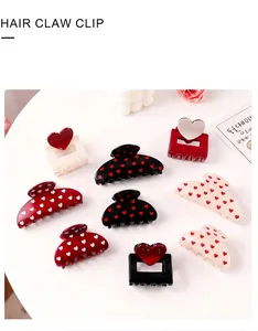 Collection of heart-patterned hair claw clips in various colors and geometric shapes
