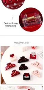 Detail of high-strength metal spring on heart-pattern hair claws for secure grip
