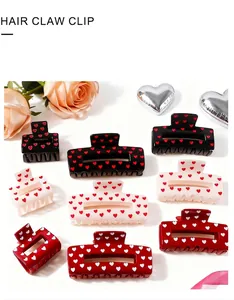 Detailed collection of heart print hair claw clips in red black and cream white colors