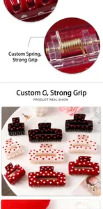 Close-up of customized gold spring on heart print hair claw clips for strong grip