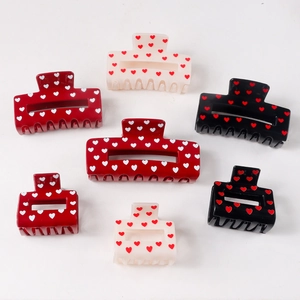 Polka dot heart claw clips in red, black and white color options and various sizes