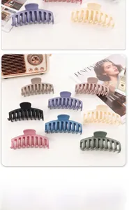 Macro shot of large matte hair claws in various Macaron colors for thick hair