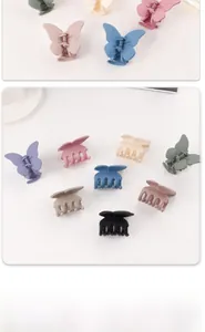 Detailed macro view showing the matte finish and texture of butterfly hair claw clips