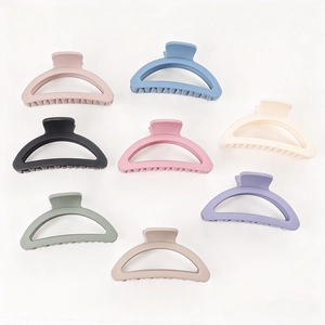 Set of 8 matte semi-circle hair claw clips in various Morandi colors on white background