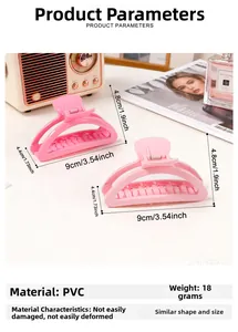 Detail showing two pink macaron hair claws with dimensions 9cm by 4.8cm on a desk