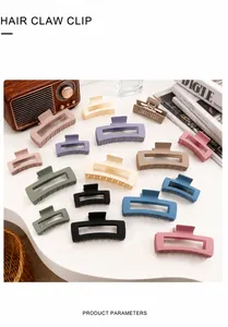 Variety of square matte hair claw clips in macaron colors arranged on a white surface