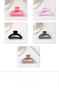 Detail view of 9cm matte macaron claw clips with hollow half-moon shape in 5 colors