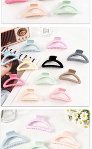 Macro detail of high-quality matte resin hair claw clips in assorted macaron candy colors