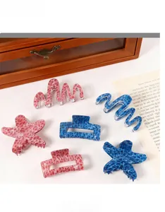 Detailed set of pink and blue leopard print hair claws in wave, starfish, and square shapes
