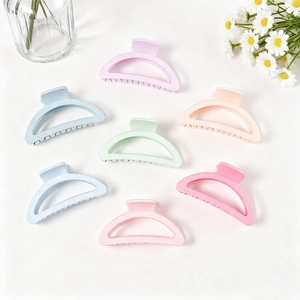 Set of seven macaron-colored semi-circular hair claw clips in various pastel shades