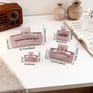 Set of four matte pink square hair claw clips in various sizes for different hair types