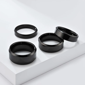Polished black tungsten steel rings set in multiple widths for a minimalist luxury look