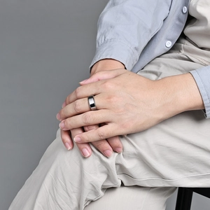 Minimalist tungsten steel ring for men with polished silver finish on finger