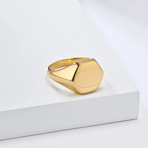Minimalist hexagonal gold signet ring made of titanium steel with a high-polished finish