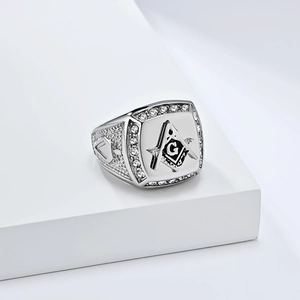 Men's silver Freemason ring with square face and cubic zirconia stones on white steps
