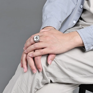 Vintage silver steel Masonic ring featuring the square and compass G symbol on a male model