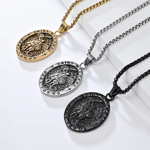 Vintage Saint Michael archangel oval pendant necklaces in gold, silver, and black steel