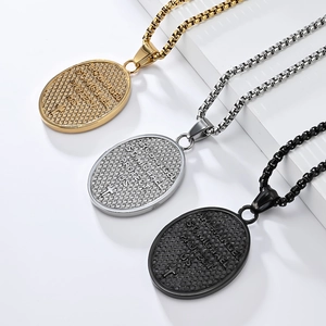 Detailed macro of St. Michael archangel pendants in gold, silver, and black finishes
