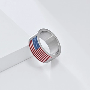 Detailed close-up of stainless steel ring featuring red, white, and blue American flag pattern
