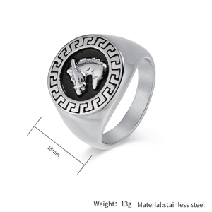 Detail of silver stainless steel signet ring with horse head sword and Greek key pattern